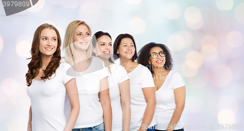 Image of group of happy different women in white t-shirts