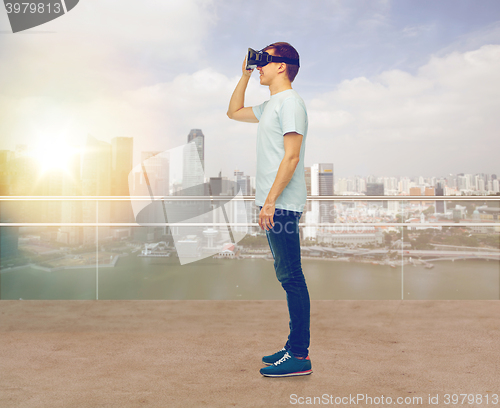 Image of happy man in virtual reality headset or 3d glasses