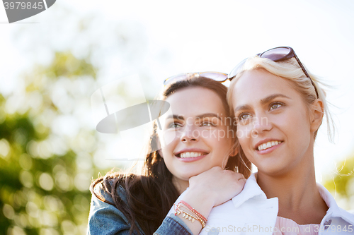 Image of happy young women or teenage girls outdoors