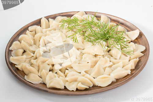 Image of Boiled prepared homemade russian dumplings or pelmeni with beef meat