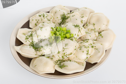 Image of Boiled prepared homemade russian dumplings or pelmeni with beef meat