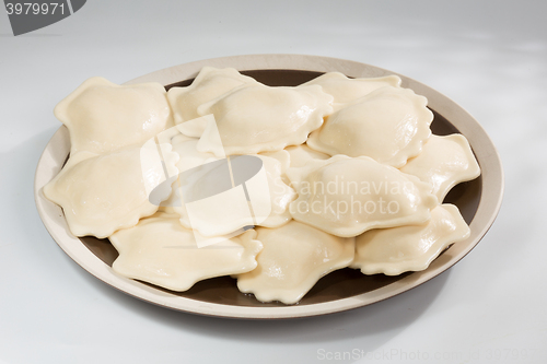 Image of Boiled prepared homemade russian dumplings or pelmeni with beef meat