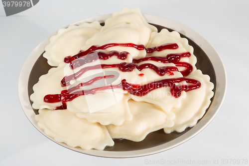 Image of Homemade traditional Ukrainian dumplings, vareniki with cherries