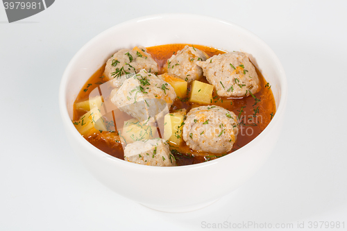 Image of Meatballs with roast potatoes and vegetables.
