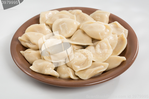 Image of Boiled prepared homemade russian dumplings or pelmeni with beef meat