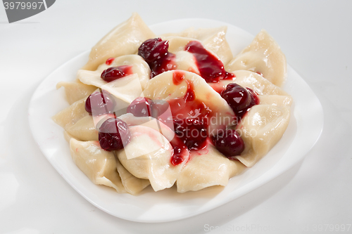 Image of Homemade traditional Ukrainian dumplings, vareniki with cherries