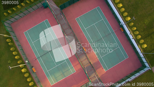 Image of Aerial view of two tennis courts