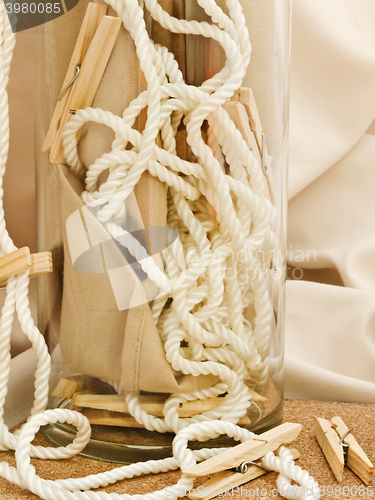 Image of Clothespins, Cord And Vase