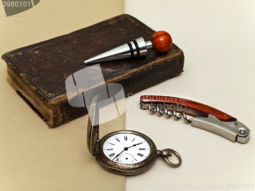 Image of Clock, Book, Corkscrew And Stopper