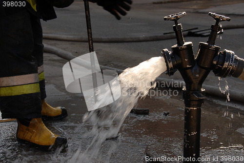 Image of Hydrant and fireman