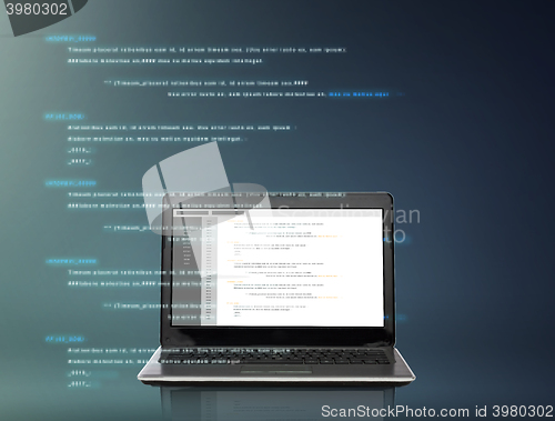 Image of laptop computer with coding on screen