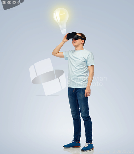 Image of happy man in virtual reality headset or 3d glasses