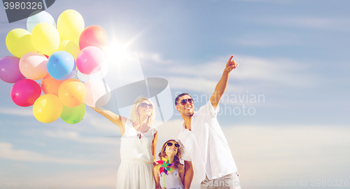 Image of family with colorful balloons