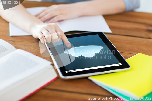 Image of close up of student with tablet pc and notebook