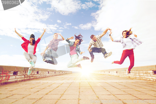 Image of group of teenagers jumping