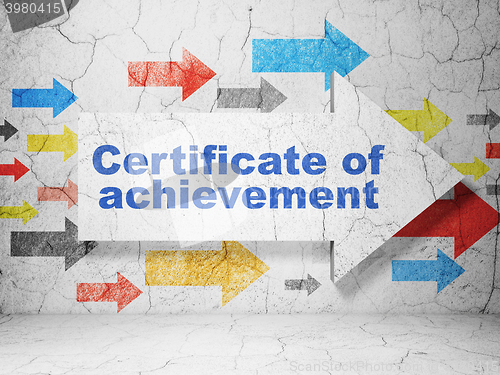 Image of Learning concept: arrow with Certificate of Achievement on grunge wall background