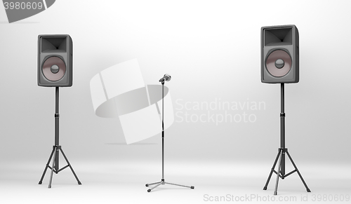 Image of Concert stage with speakers and microphone