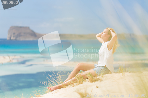 Image of Relaxed Happy Woman Enjoying Sun on Vacations.