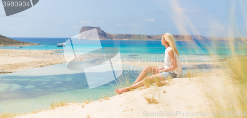 Image of Relaxed Happy Woman Enjoying Sun on Vacations.