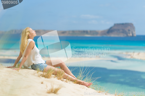 Image of Relaxed Happy Woman Enjoying Sun on Vacations.