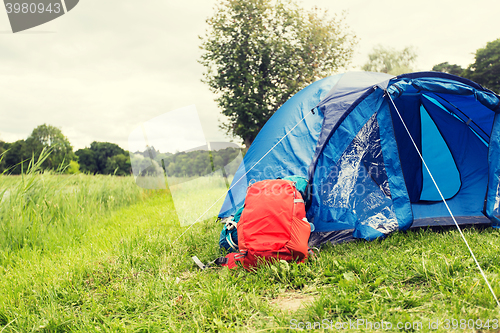 Image of touristic tent and backpack outdoors