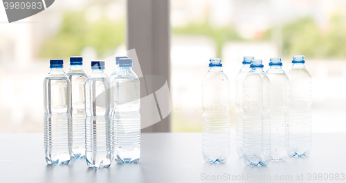 Image of close up of bottles with drinking water on table