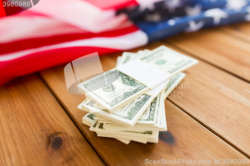 Image of close up of american flag and dollar cash money