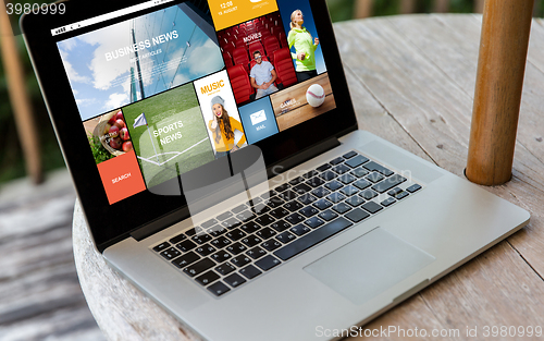 Image of close up of laptop computer on table at hotel