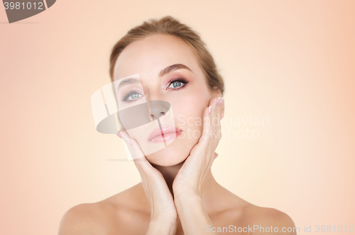 Image of beautiful young woman face and hands