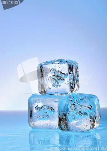 Image of Three ice cubes on glass 