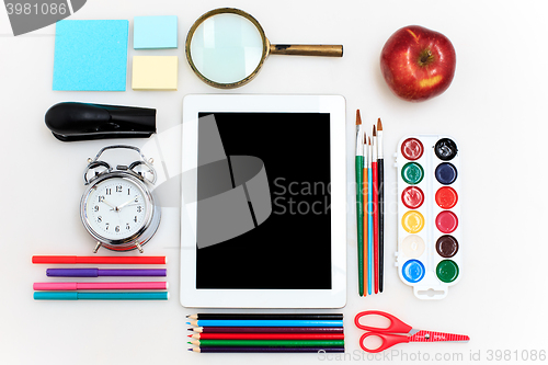 Image of School set with notebooks, pencils, brush, scissors and apple on white background