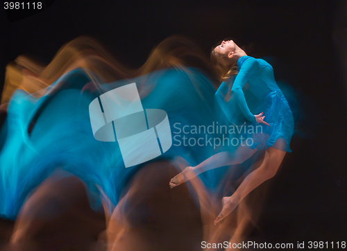Image of The art photo-emotional dance of beautiful blue woman