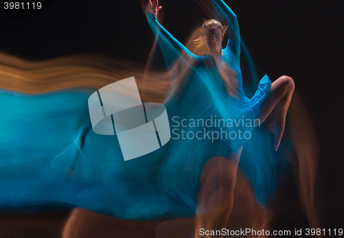 Image of The art photo-emotional dance of beautiful blue woman