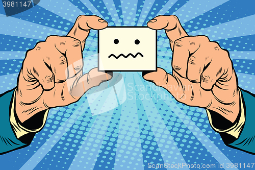 Image of silence Smiley face in hands