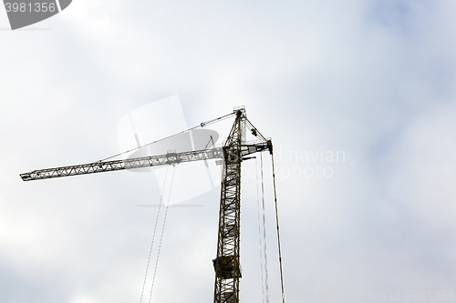 Image of construction crane, sky  