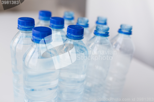 Image of close up of bottles with drinking water on table