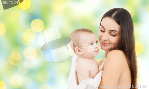 Image of happy mother holding adorable baby