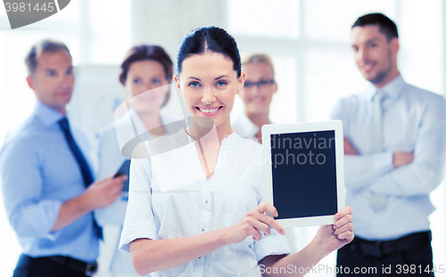 Image of businesswoman with tablet pc in office