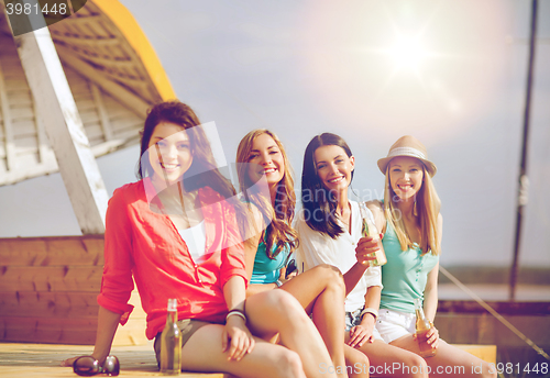 Image of girls with drinks on the beach