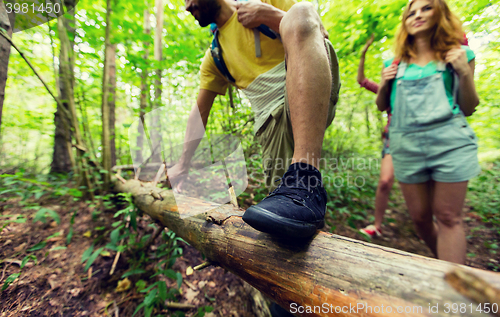 Image of close up of friends with backpacks hiking