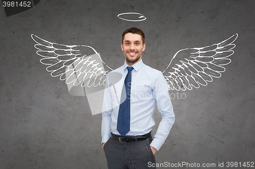 Image of smiling businessman with angel wings and nimbus