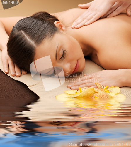 Image of beautiful woman in massage salon