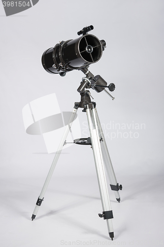 Image of reflector telescope on a white background