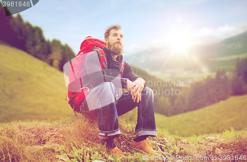 Image of man with backpack hiking
