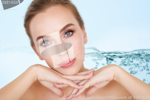 Image of beautiful young woman face and hands