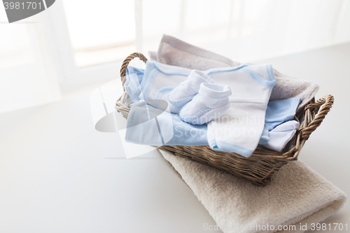 Image of close up of baby clothes for newborn boy in basket