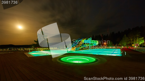 Image of resort pool at night