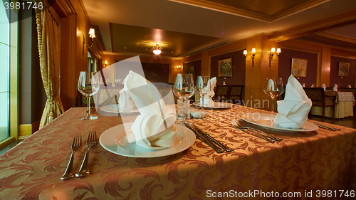 Image of Empty wine glasses set in restaurant