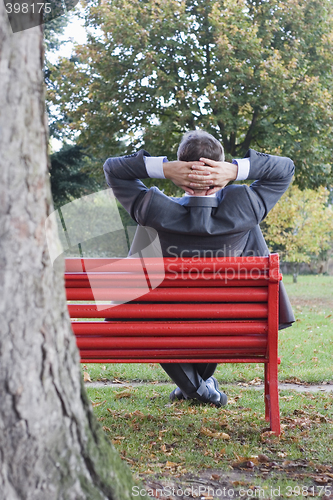 Image of Manager on park bench