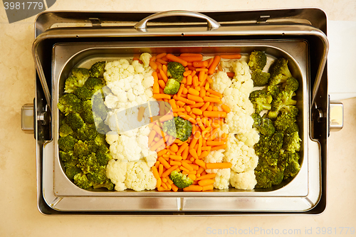 Image of steamed vegetables in a dining room at breakfast in the hotel